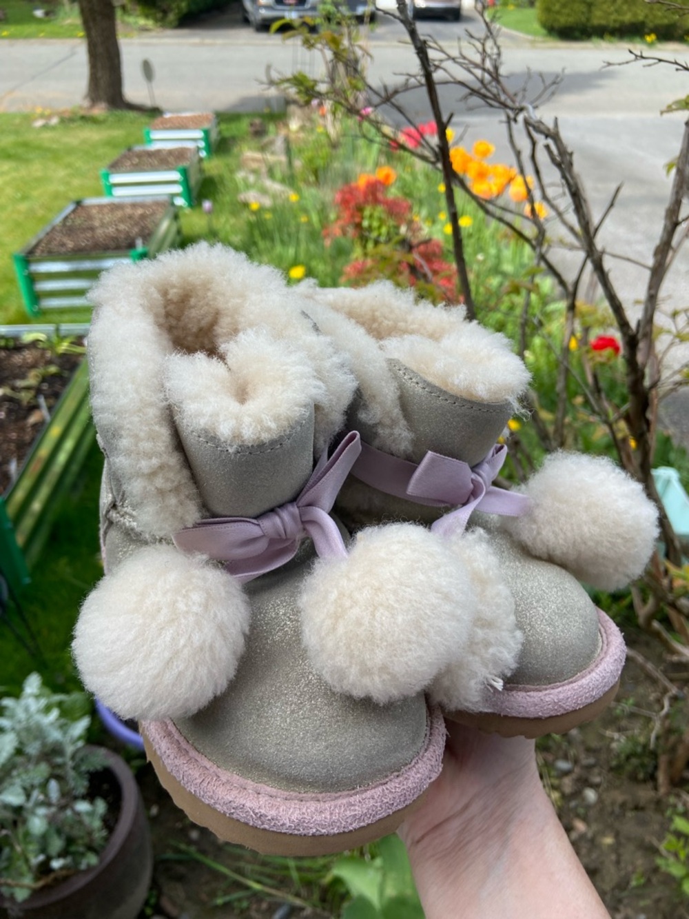 UGG Kids Beige Sheepskin Pom Pom Boots with Pink Trim